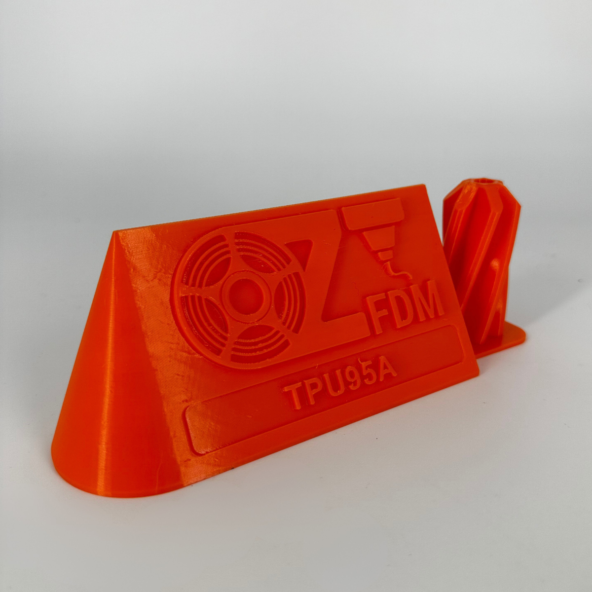 Display filament, TPU95A Orange. 3D printed by Global3D