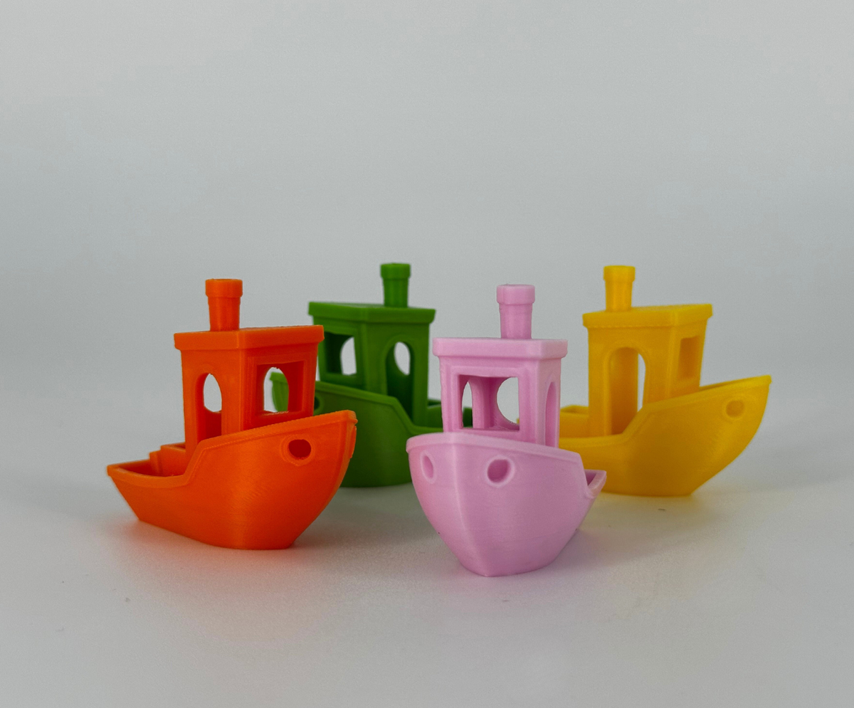 Fleet of Benchys, OzFDM ABS+ Green, Orange, Yellow and Pink. 3D printed by Global3D