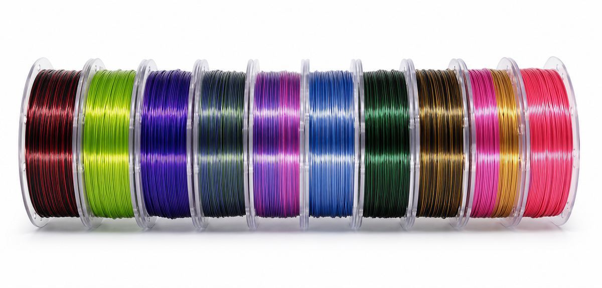 Row of OzFDM Silk Fusion PLA spools showing the dual-colour combinations