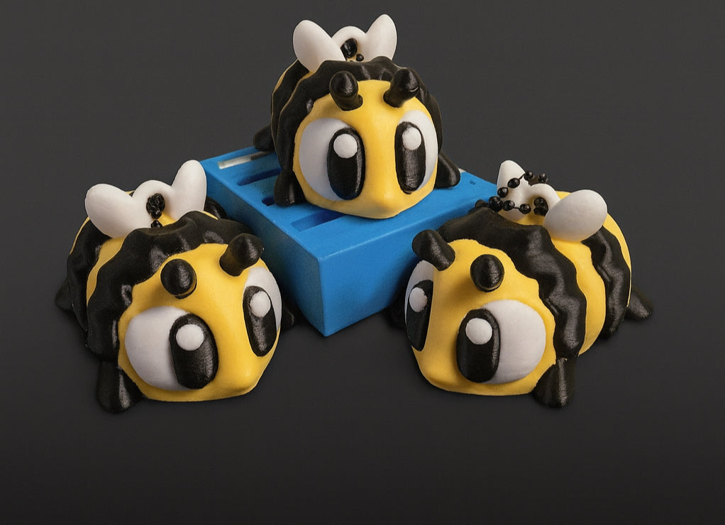 Bee key chains printed in PLA+. Credit: SeaMonkey Crafts