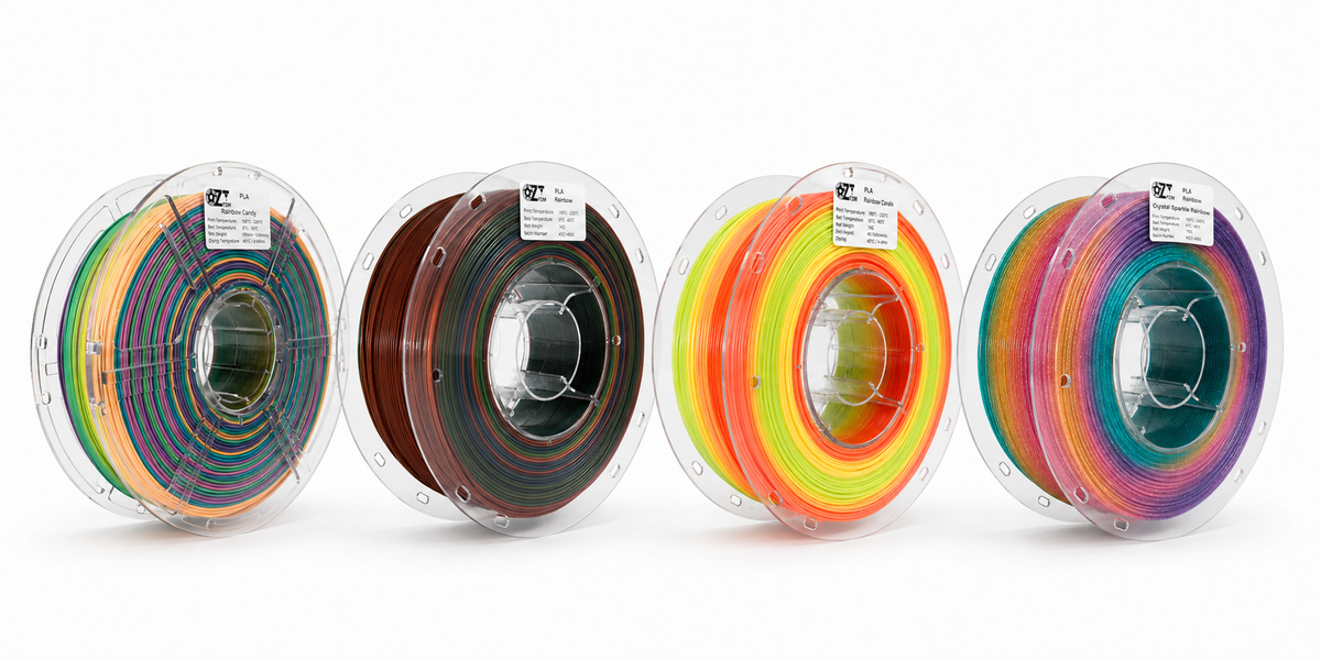 Four OzFDM PLA Rainbow spools showing the colour transitions along the filament