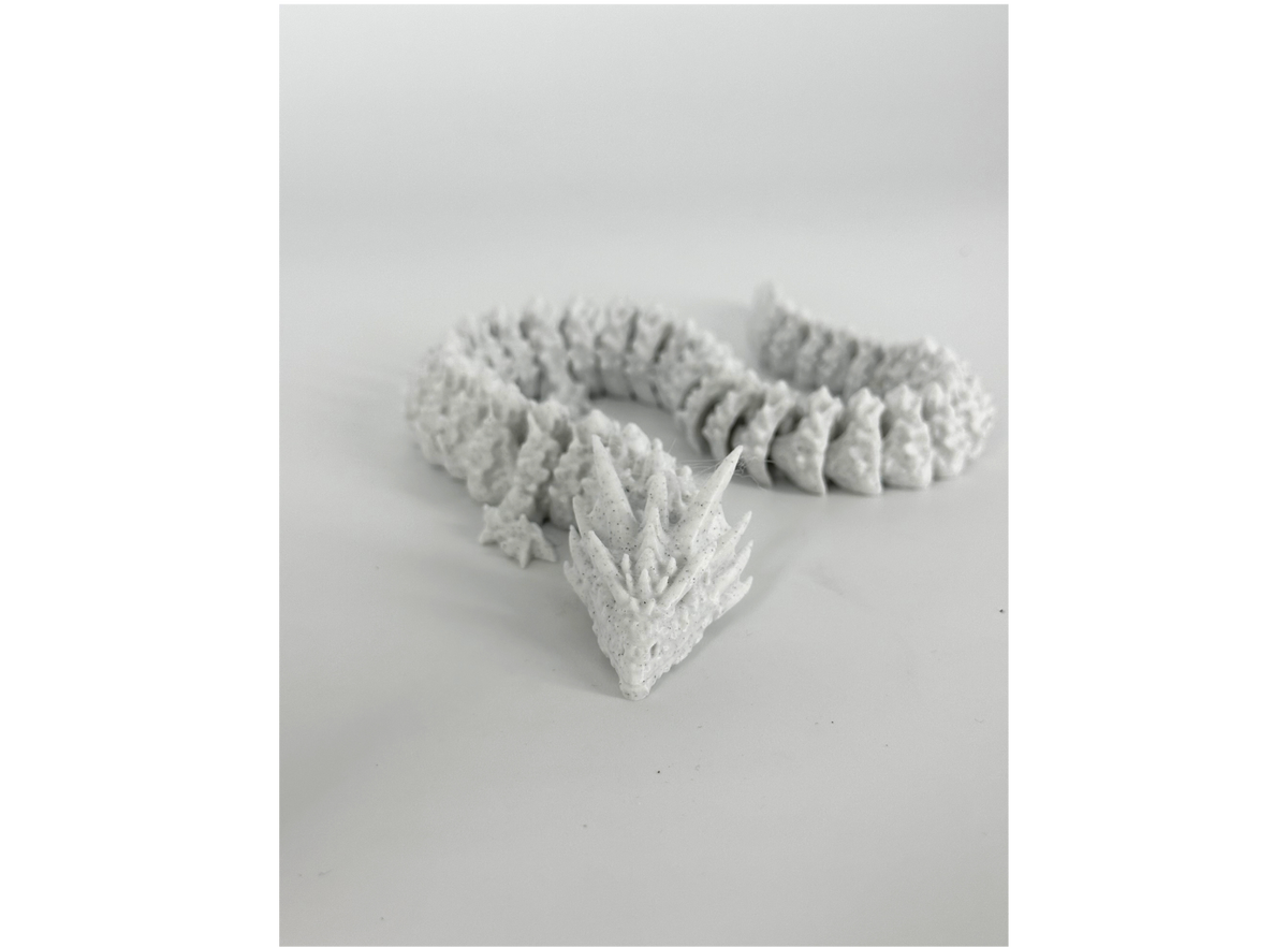 Articulated dragon printed in OzFDM PLA Marble with a grey speckled finish
