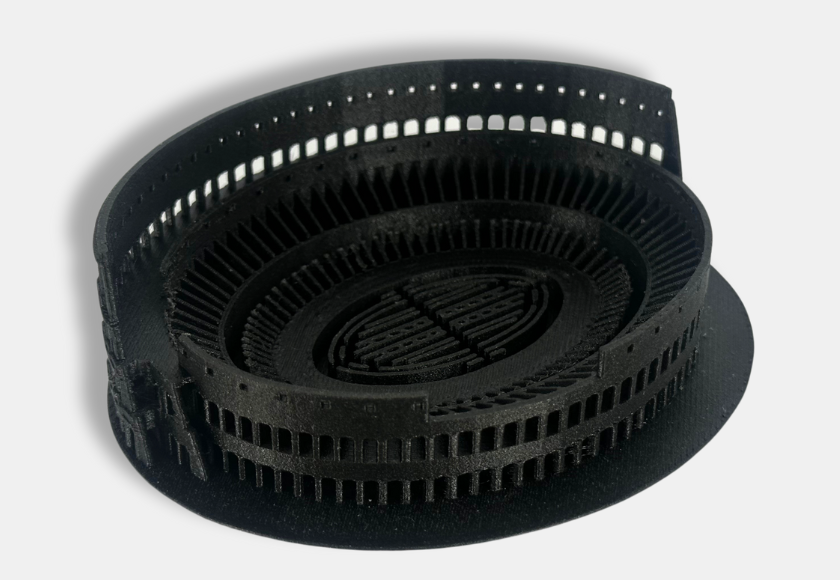 Black PPA-CF printed part with a perforated curved wall