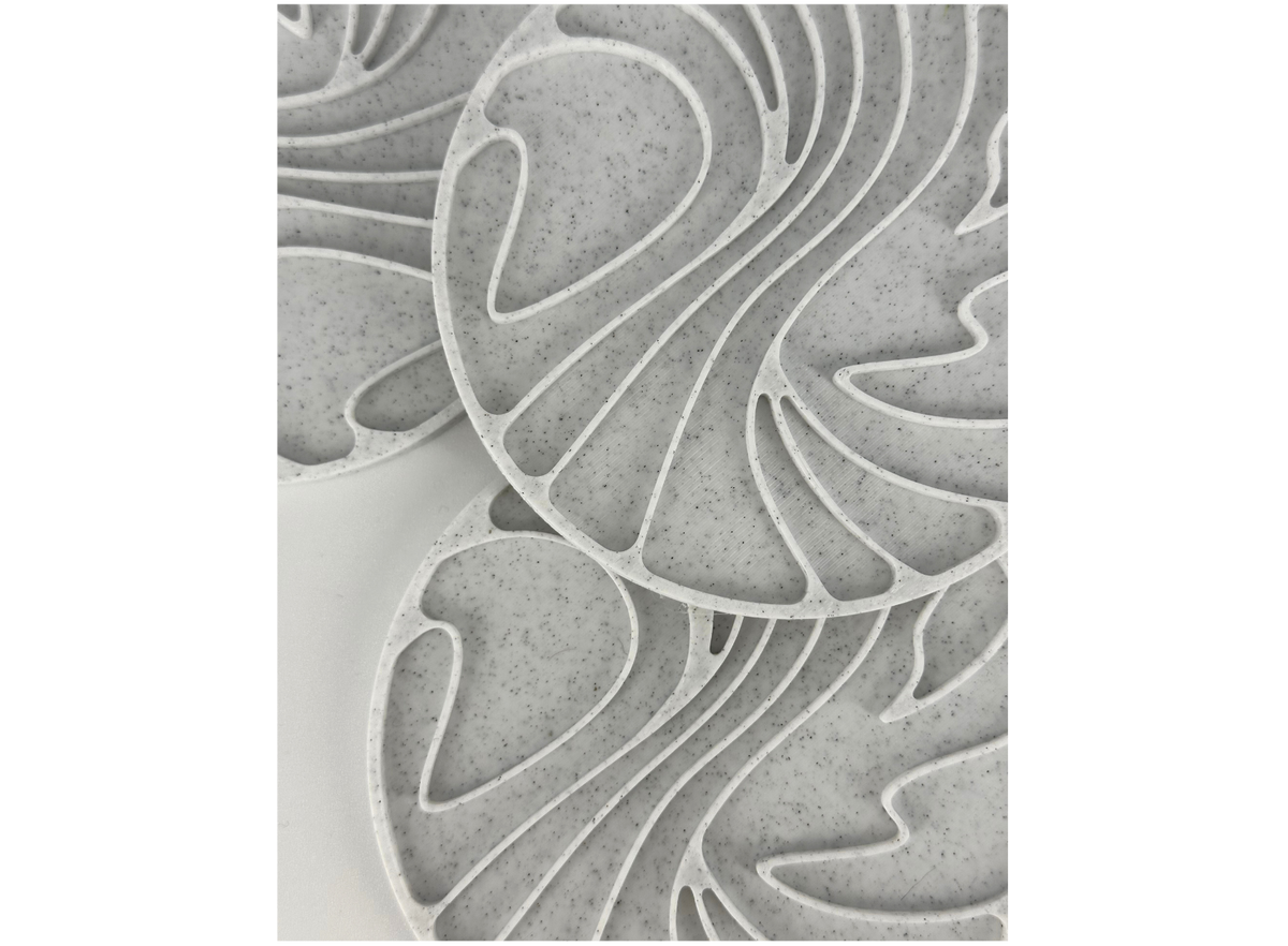Close-up of a PLA Marble print showing the speckled, stone-like surface