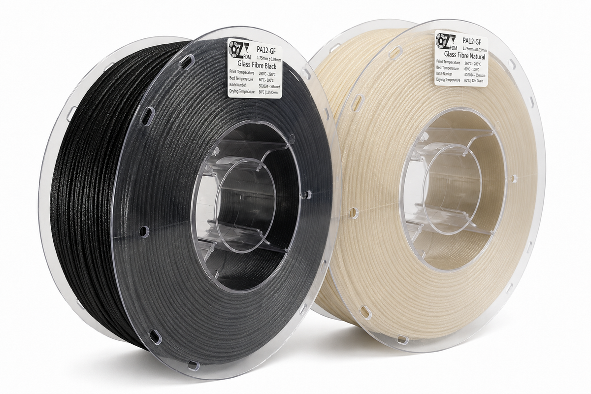Two OzFDM PA12-GF spools, black and natural