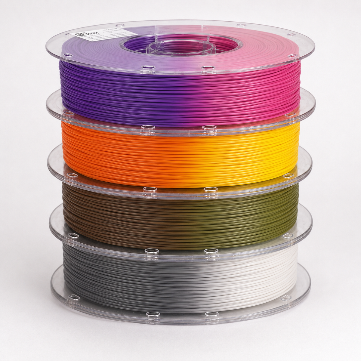 Stack of OzFDM PLA Colour Change spools showing purple-rose, orange-yellow, brown-green and grey-white