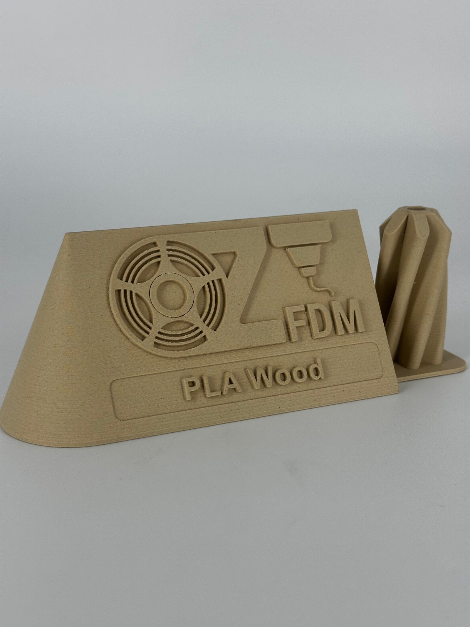 OzFDM logo plaque printed in PLA Wood, angled view