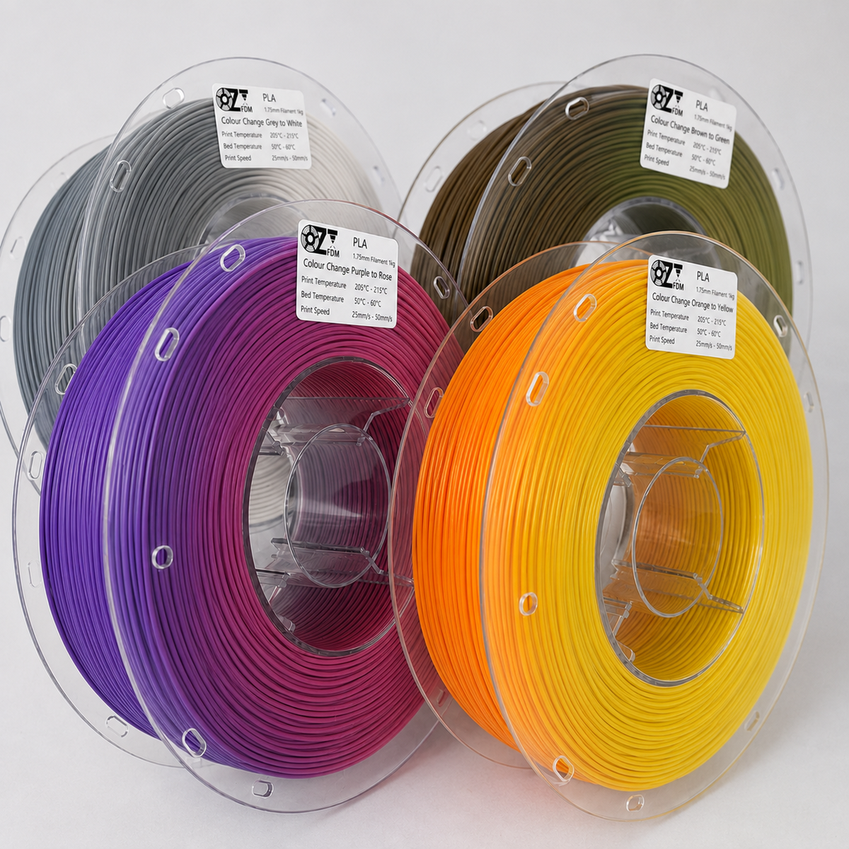 Four OzFDM PLA Colour Change spools in grey, purple, olive and orange