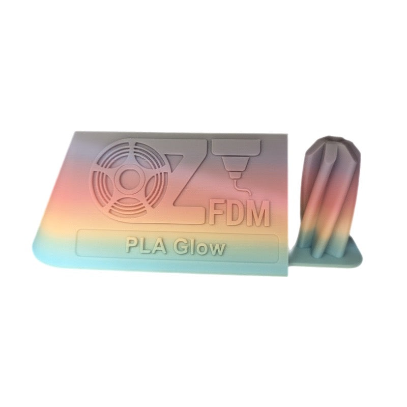 3D printed OzFDM sample plaque and vase in rainbow PLA Glow filament, shown in daylight